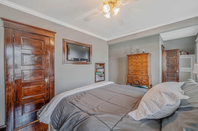 33 S Bay Ave, Amityville, NY 11701 - bedroom with wood finished floors, ornamental molding, and a ceiling fan