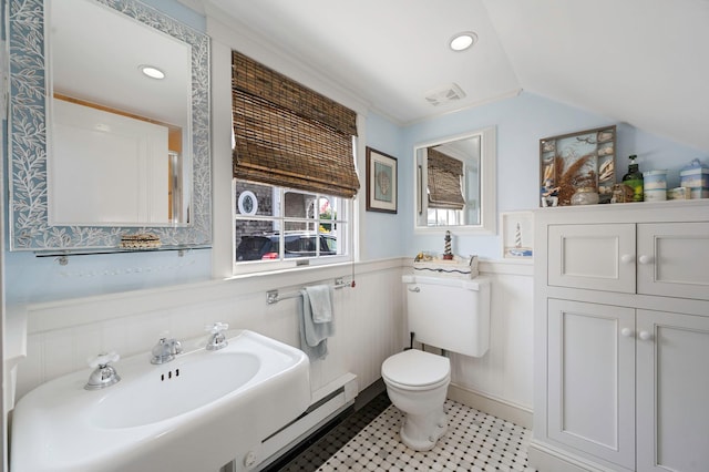 33 S Bay Ave, Amityville, NY 11701 - full bathroom featuring wainscoting, vaulted ceiling, a baseboard heating unit, and recessed lighting