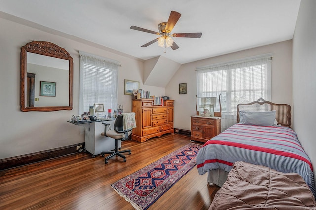 33 S Bay Ave, Amityville, NY 11701 - bedroom featuring multiple windows, hardwood / wood-style flooring, an office area, and ceiling fan