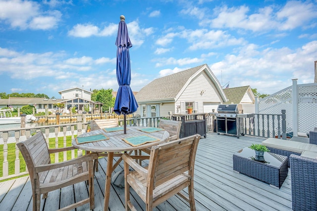 33 S Bay Ave, Amityville, NY 11701 - wooden deck with grilling area and outdoor dining area