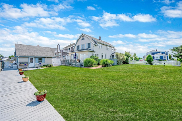 33 S Bay Ave, Amityville, NY 11701 - back of house with a fenced backyard and a wooden deck