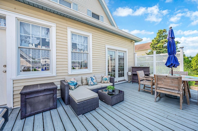 33 S Bay Ave, Amityville, NY 11701 - wooden deck featuring outdoor dining area and an outdoor living space