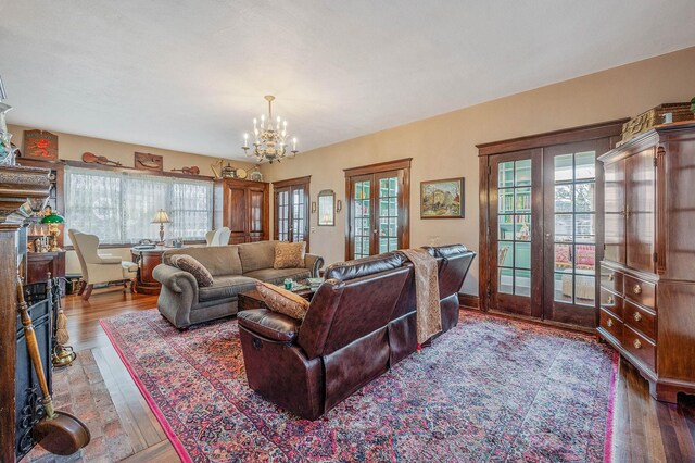 33 S Bay Ave, Amityville, NY 11701 - living room featuring french doors, a chandelier, and hardwood / wood-style floors