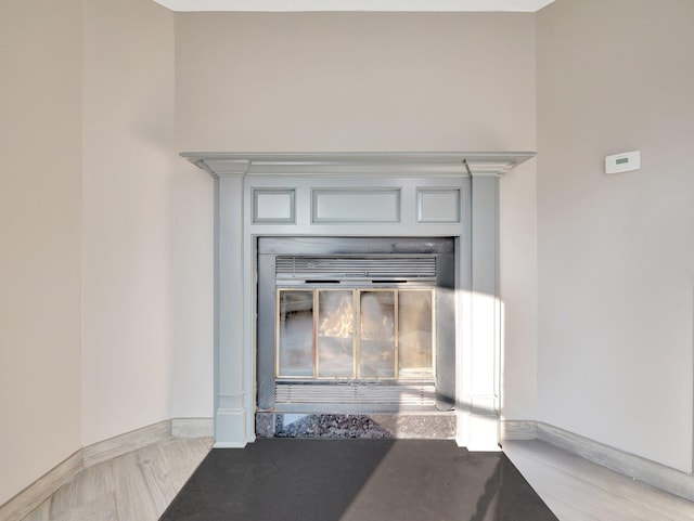 285 Hill Rd, Goshen, NY 10940 - detailed view of a glass covered fireplace and wood finished floors