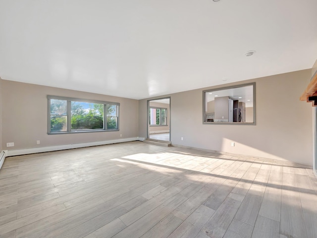285 Hill Rd, Goshen, NY 10940 - unfurnished living room with wood finished floors and baseboard heating