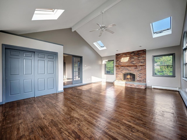 285 Hill Rd, Goshen, NY 10940 - unfurnished living room featuring a skylight, beam ceiling, wood finished floors, plenty of natural light, and high vaulted ceiling