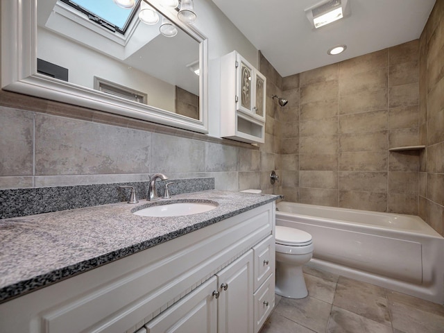285 Hill Rd, Goshen, NY 10940 - bathroom with a skylight, vanity, bathing tub / shower combination, tile patterned flooring, and tile walls