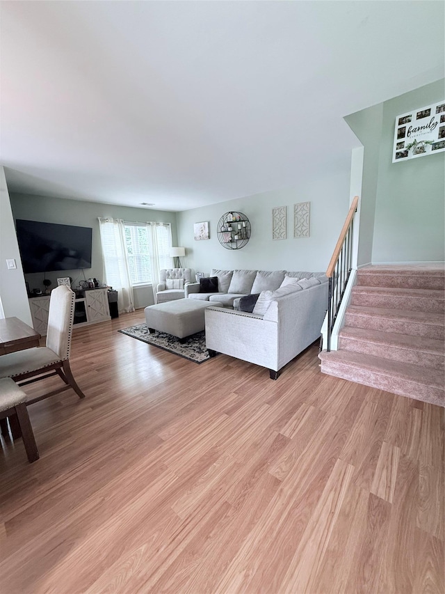 5 Petersen Ct Unit 5, West Babylon, NY 11704 - living room featuring light wood-style flooring and stairs