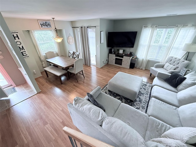 5 Petersen Ct Unit 5, West Babylon, NY 11704 - living room with plenty of natural light and light wood-style flooring