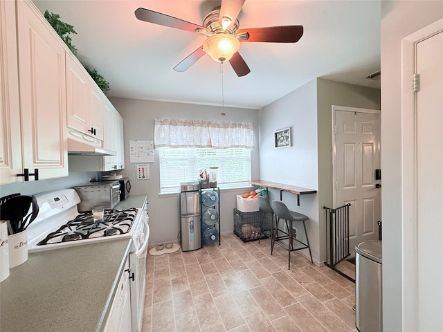 5 Petersen Ct Unit 5, West Babylon, NY 11704 - kitchen with white range with gas stovetop, under cabinet range hood, a ceiling fan, white cabinetry, and light countertops
