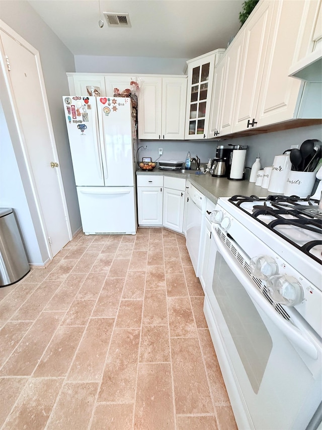 5 Petersen Ct Unit 5, West Babylon, NY 11704 - kitchen with white appliances, white cabinetry, and glass insert cabinets