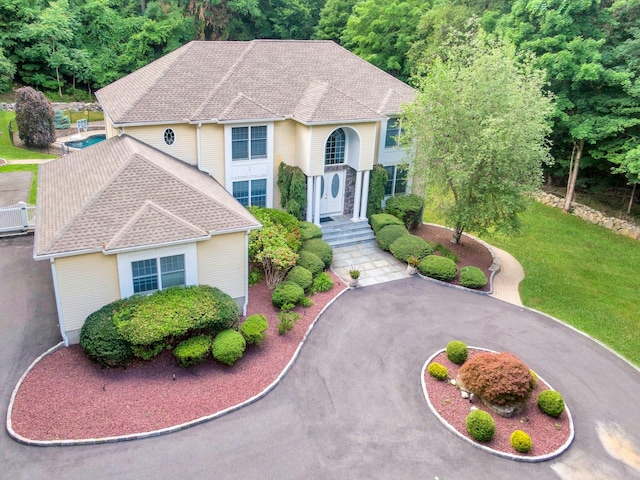 29 Brian Ct, Carmel, NY 10512 - view of front of house featuring roof with shingles and a front lawn