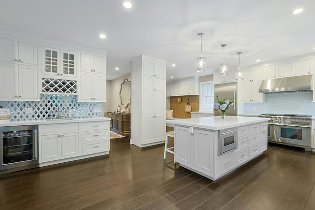 29 Brian Ct, Carmel, NY 10512 - kitchen with under cabinet range hood, wine cooler, double oven range, tasteful backsplash, and recessed lighting