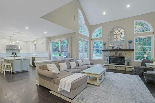 29 Brian Ct, Carmel, NY 10512 - living room featuring dark wood finished floors, recessed lighting, a towering ceiling, and a fireplace