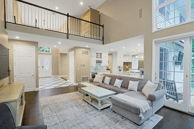 29 Brian Ct, Carmel, NY 10512 - living room with dark wood finished floors, a towering ceiling, and wine cooler