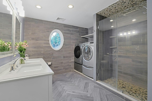 29 Brian Ct, Carmel, NY 10512 - bathroom with washer and clothes dryer, tile walls, a stall shower, double vanity, and recessed lighting