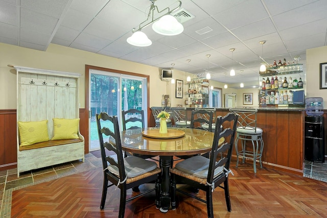 29 Brian Ct, Carmel, NY 10512 - dining area with a bar, a paneled ceiling, and wainscoting