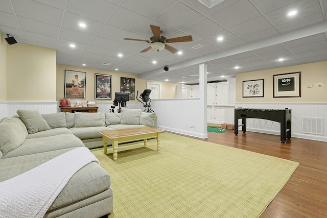 29 Brian Ct, Carmel, NY 10512 - living room with wood finished floors, a ceiling fan, and a wainscoted wall
