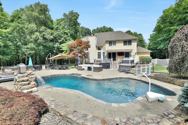 29 Brian Ct, Carmel, NY 10512 - view of swimming pool featuring an outdoor kitchen, a patio, and an outdoor hangout area