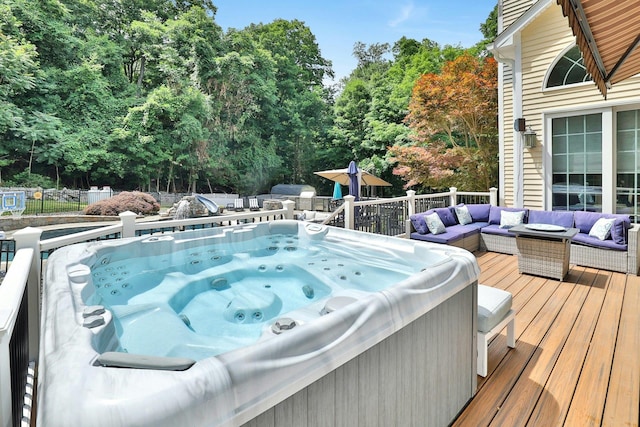 29 Brian Ct, Carmel, NY 10512 - view of swimming pool with a deck, a hot tub, outdoor lounge area, and view of wooded area