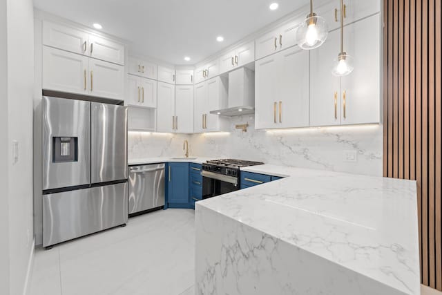 658 E 91st St, Brooklyn, NY 11236 - kitchen featuring stainless steel appliances, wall chimney range hood, blue cabinets, light stone counters, and tasteful backsplash