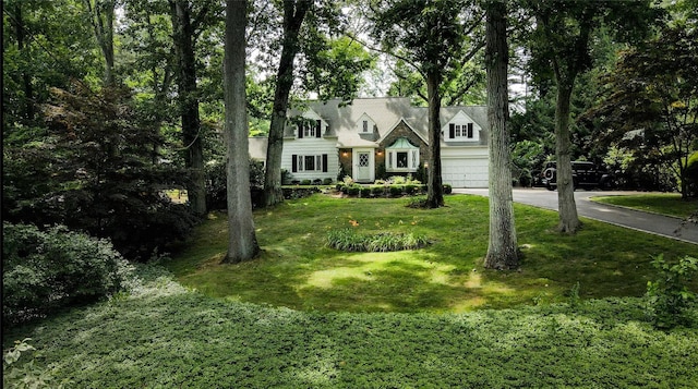 15 Glen Pk Rd, Purchase, NY 10577 - cape cod-style house with driveway, a front lawn, and an attached garage