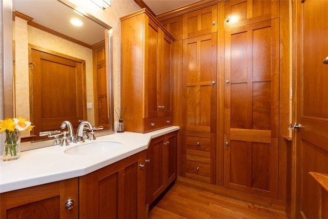 15 Glen Pk Rd, Purchase, NY 10577 - bathroom with vanity, wood finished floors, and ornamental molding