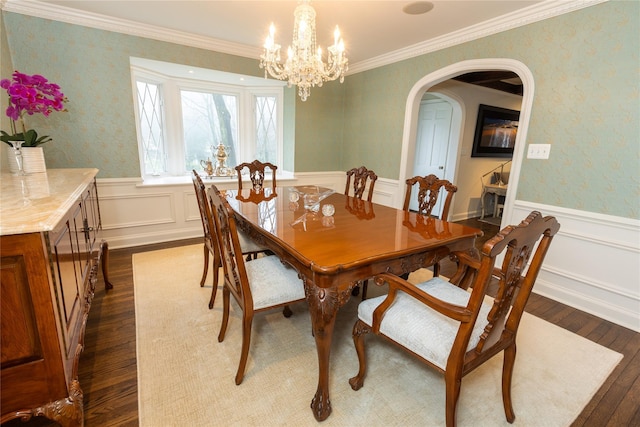 15 Glen Pk Rd, Purchase, NY 10577 - dining space with arched walkways, dark wood finished floors, wallpapered walls, a wainscoted wall, and a chandelier