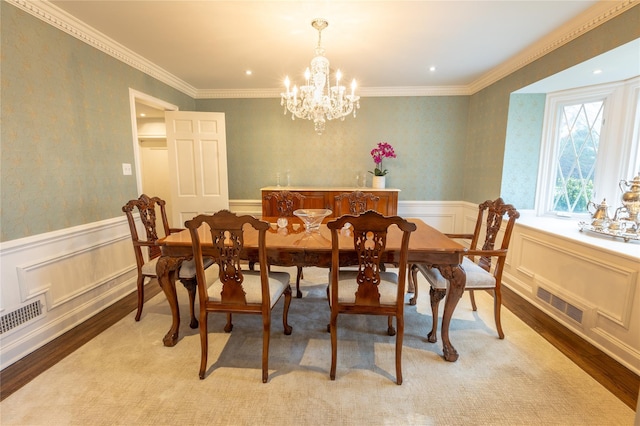 15 Glen Pk Rd, Purchase, NY 10577 - dining room featuring light wood-type flooring, a chandelier, ornamental molding, wainscoting, and wallpapered walls
