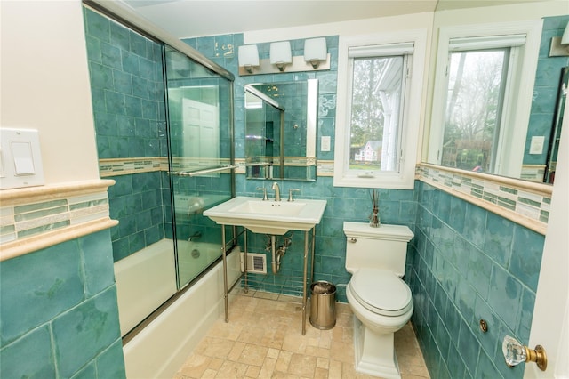 15 Glen Pk Rd, Purchase, NY 10577 - full bath featuring tile walls, enclosed tub / shower combo, and stone finish floors