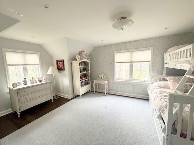 15 Glen Pk Rd, Purchase, NY 10577 - bedroom featuring wallpapered walls, lofted ceiling, and wood finished floors