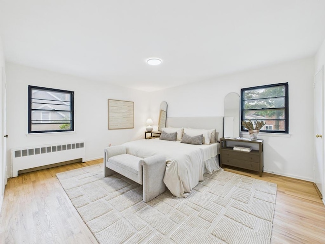 811 Bellmore Ave, East Meadow, NY 11554 - bedroom featuring radiator and wood finished floors