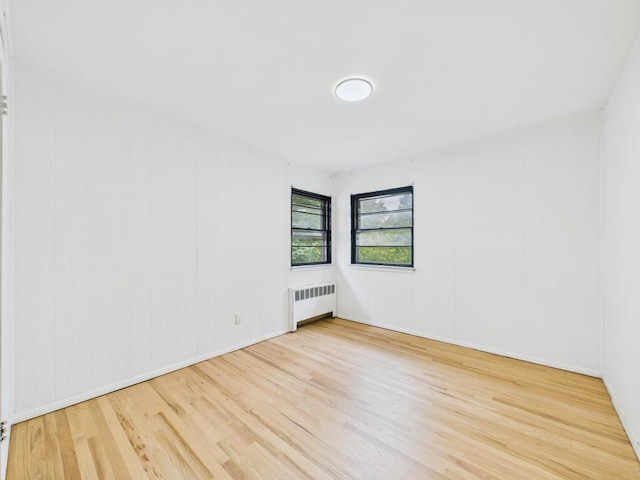 811 Bellmore Ave, East Meadow, NY 11554 - unfurnished room featuring radiator and wood finished floors