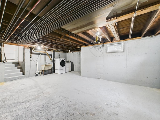 811 Bellmore Ave, East Meadow, NY 11554 - unfinished basement featuring separate washer and dryer and stairs