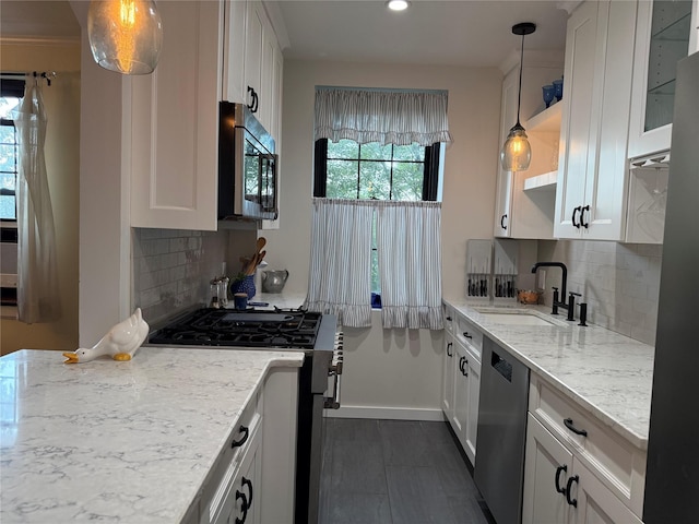 1273 N Ave Unit 4F-5, New Rochelle, NY 10804 - kitchen with appliances with stainless steel finishes, white cabinets, light stone counters, recessed lighting, and tasteful backsplash