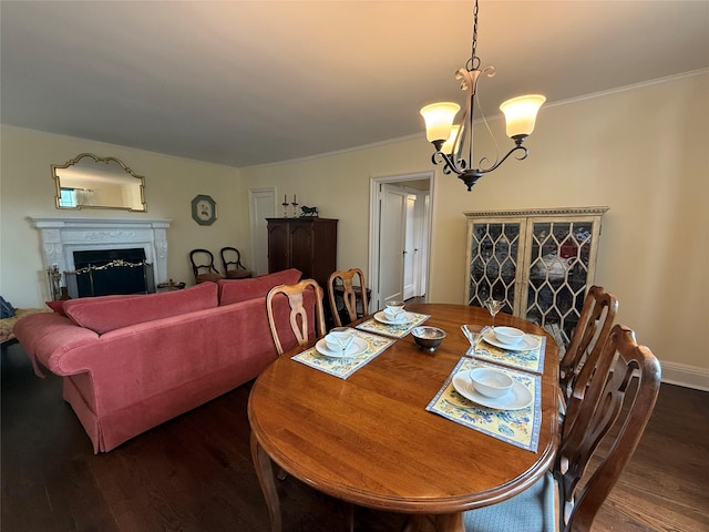 1273 N Ave Unit 4F-5, New Rochelle, NY 10804 - dining space featuring dark wood-style flooring, a chandelier, a fireplace, and ornamental molding