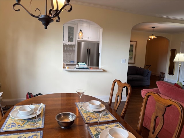 1273 N Ave Unit 4F-5, New Rochelle, NY 10804 - dining area with arched walkways, crown molding, a chandelier, and wood finished floors