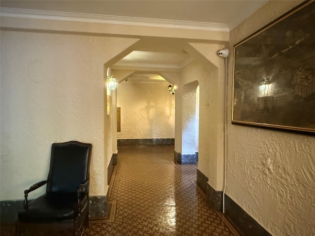 1273 N Ave Unit 4F-5, New Rochelle, NY 10804 - hall featuring arched walkways, tile patterned floors, ornamental molding, and a textured wall