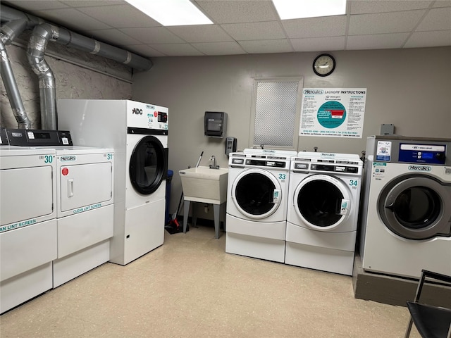 1273 N Ave Unit 4F-5, New Rochelle, NY 10804 - communal laundry room featuring washer and clothes dryer and light flooring