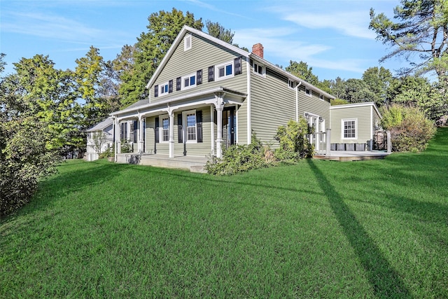 27 County Route 19, Hudson, NY 12534 - back of property with covered porch, a yard, and a chimney