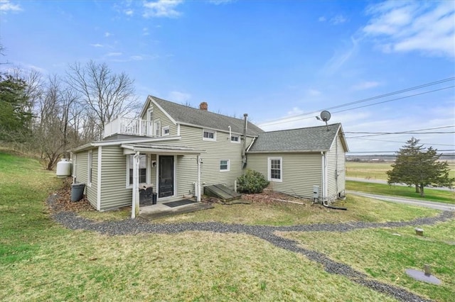 27 County Route 19, Hudson, NY 12534 - back of property with a lawn, a shingled roof, and a chimney