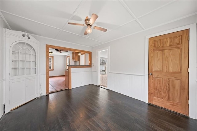 27 County Route 19, Hudson, NY 12534 - unfurnished living room featuring a ceiling fan, dark wood-style flooring, healthy amount of natural light, and wainscoting