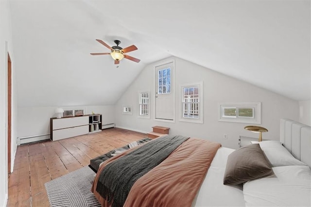 27 County Route 19, Hudson, NY 12534 - bedroom featuring hardwood / wood-style flooring, baseboard heating, vaulted ceiling, and a ceiling fan