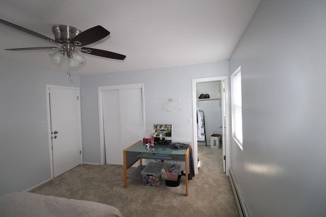242 W Centennial Ave, Roosevelt, NY 11575 - living room with carpet floors and ceiling fan