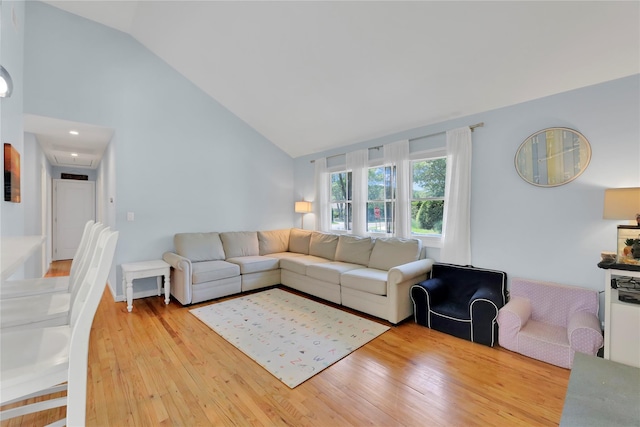 75 Lynncliff Rd, Hampton Bays, NY 11946 - living area featuring light wood finished floors and high vaulted ceiling