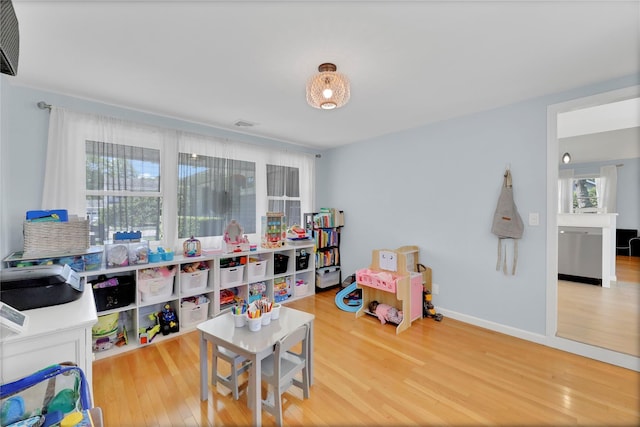 75 Lynncliff Rd, Hampton Bays, NY 11946 - playroom with wood finished floors and baseboards