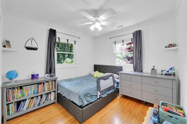 75 Lynncliff Rd, Hampton Bays, NY 11946 - bedroom with crown molding, light wood-style floors, and a ceiling fan