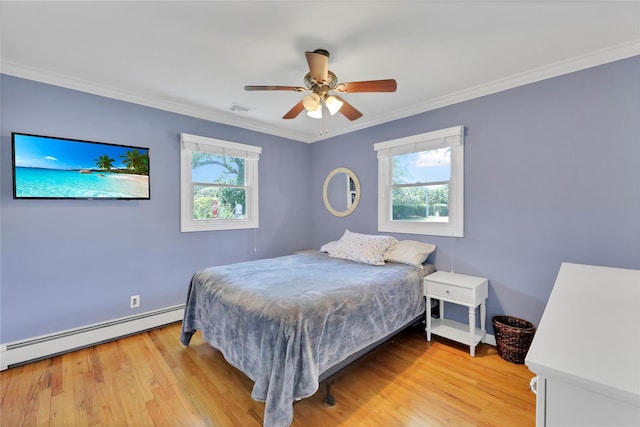 75 Lynncliff Rd, Hampton Bays, NY 11946 - bedroom featuring baseboard heating, multiple windows, light wood-type flooring, crown molding, and ceiling fan
