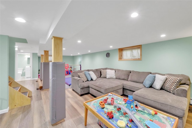 75 Lynncliff Rd, Hampton Bays, NY 11946 - living room featuring light wood-style floors, recessed lighting, and stairs