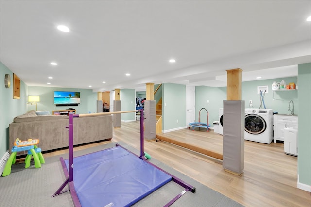 75 Lynncliff Rd, Hampton Bays, NY 11946 - workout area featuring washer / clothes dryer, light wood-type flooring, and recessed lighting